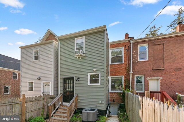 4033 Woodhaven Ave, Baltimore, MD 21216 - rear view of house with a chimney and cooling unit