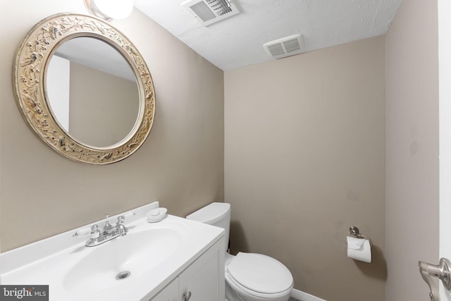1823 Westmoreland St, Mclean, VA 22101 - half bathroom featuring toilet, vanity, and a textured ceiling