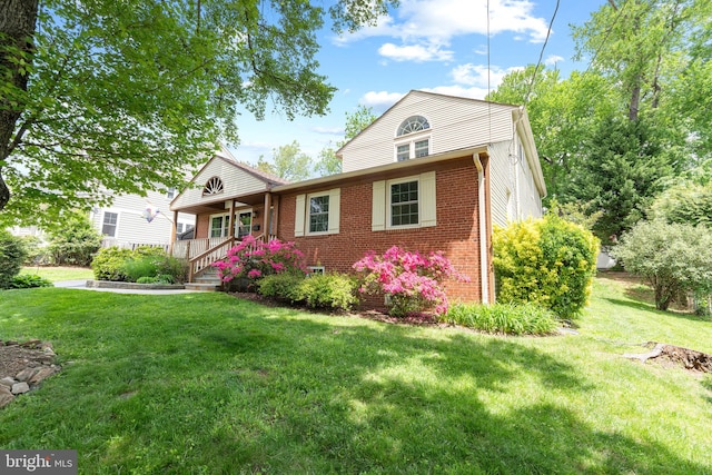 1823 Westmoreland St, Mclean, VA 22101 - view of front facade featuring brick siding, a front lawn, and covered porch