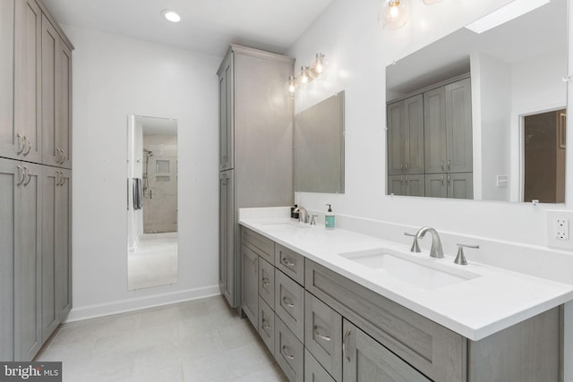 1823 Westmoreland St, Mclean, VA 22101 - bathroom featuring double vanity, baseboards, and recessed lighting