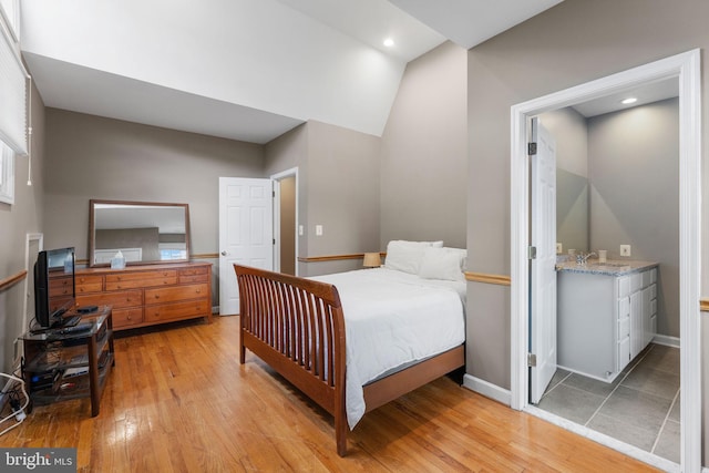 1823 Westmoreland St, Mclean, VA 22101 - bedroom featuring light wood-type flooring, baseboards, vaulted ceiling, and a sink
