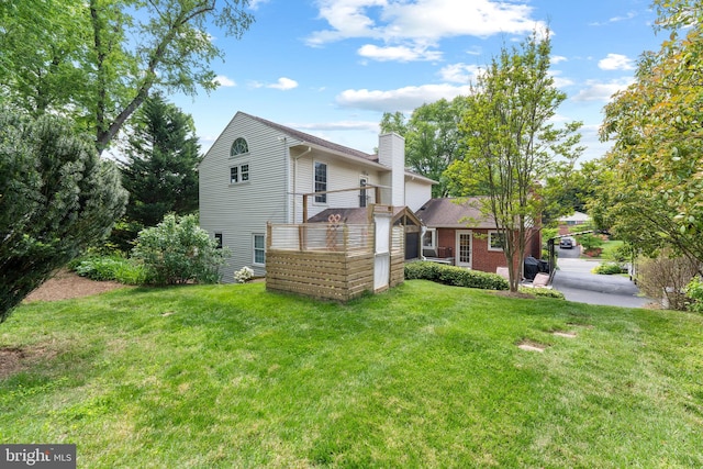 1823 Westmoreland St, Mclean, VA 22101 - back of property with a chimney and a lawn