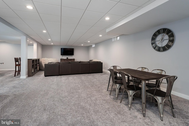 carpeted dining room featuring baseboards and recessed lighting