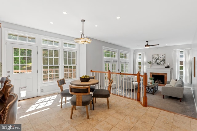 5325 Sandy Point Ln, Clifton, VA 20124 - dining space with healthy amount of natural light, a ceiling fan, recessed lighting, a fireplace, and light tile patterned flooring