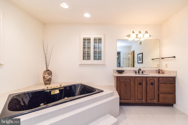 full bath featuring tile patterned flooring, vanity, a tub with jets, and recessed lighting