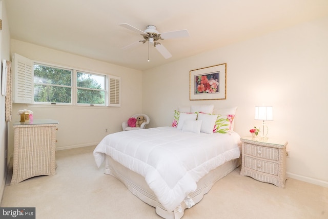 bedroom featuring carpet floors, baseboards, and a ceiling fan