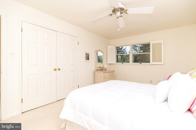 bedroom featuring carpet, a closet, and ceiling fan