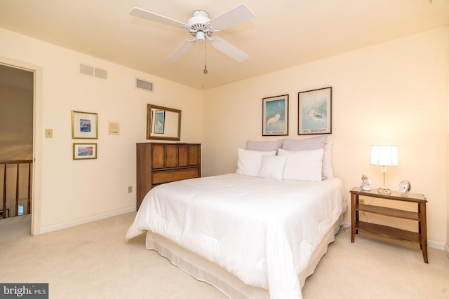 bedroom featuring light carpet, baseboards, and ceiling fan