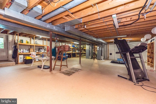 unfinished basement featuring heating unit