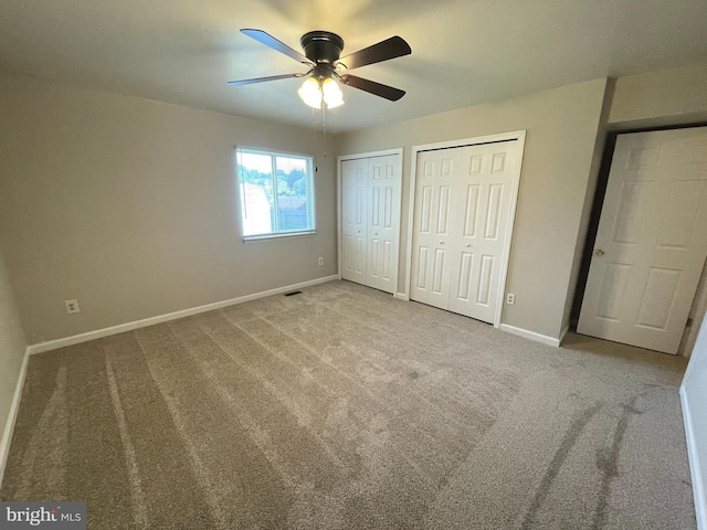 7944 Tick Neck Rd, Pasadena, MD 21122 - unfurnished bedroom with multiple closets, baseboards, and carpet