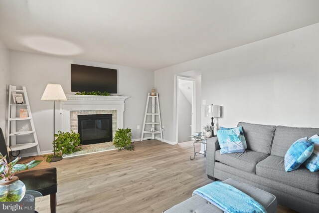 3815 Gawayne Ter Unit 31-381, Silver Spring, MD 20906 - living area with baseboards, a fireplace, and wood finished floors