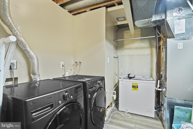 3815 Gawayne Ter Unit 31-381, Silver Spring, MD 20906 - washroom featuring laundry area, washing machine and dryer, and wood finished floors