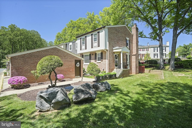 3815 Gawayne Ter Unit 31-381, Silver Spring, MD 20906 - rear view of property featuring a lawn, brick siding, and a chimney