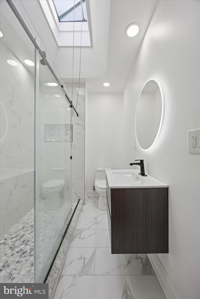 5223 Pentridge St, Philadelphia, PA 19143 - bathroom with toilet, a skylight, marble look tiles, a marble finish shower, and vanity
