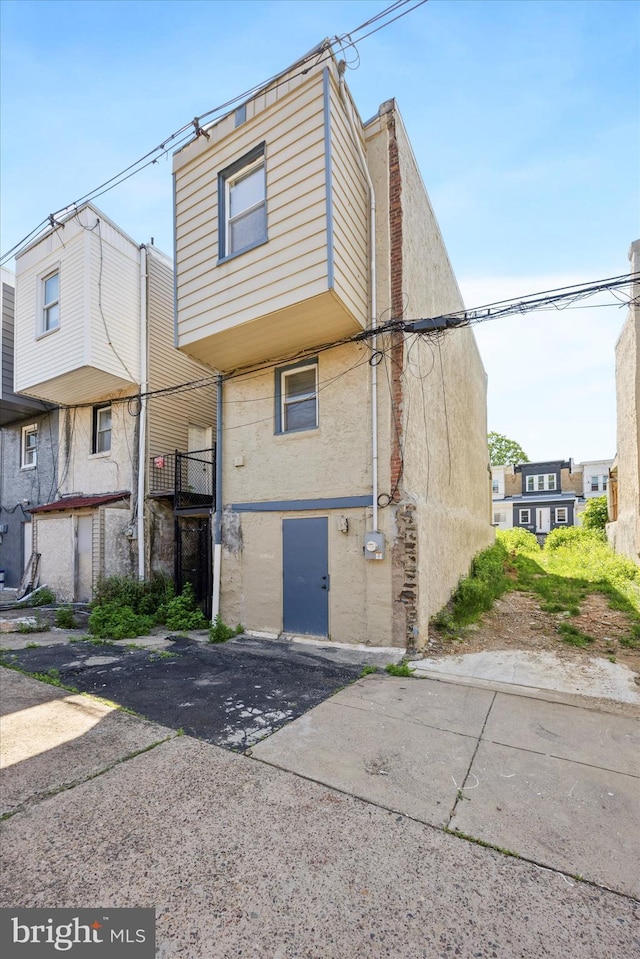 5223 Pentridge St, Philadelphia, PA 19143 - back of house featuring stucco siding