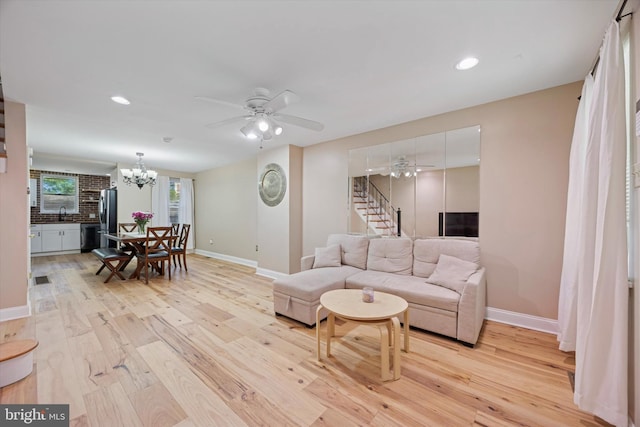 5223 Pentridge St, Philadelphia, PA 19143 - living area featuring light wood-type flooring, baseboards, a chandelier, ceiling fan, and recessed lighting