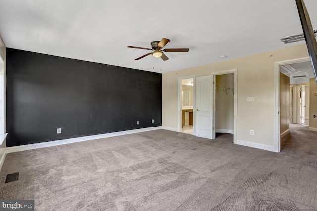unfurnished bedroom featuring carpet flooring, baseboards, visible vents, and a closet