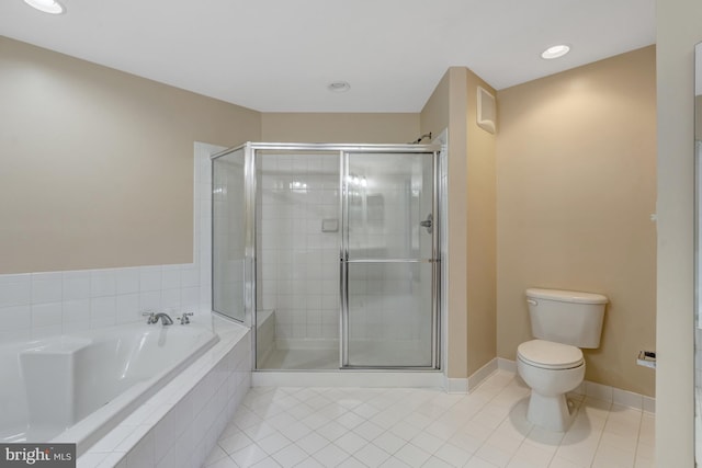 bathroom featuring a bath, tile patterned flooring, a stall shower, toilet, and recessed lighting
