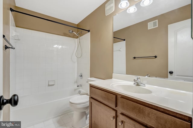 bathroom with visible vents, vanity, toilet, tile patterned floors, and shower / bath combination
