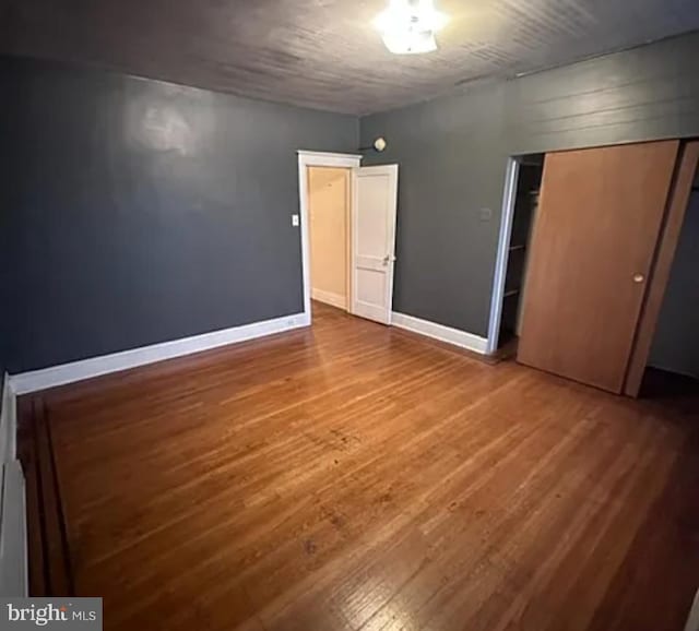 1911 Mckean St, Philadelphia, PA 19145 - unfurnished bedroom with wood finished floors, a closet, and baseboards