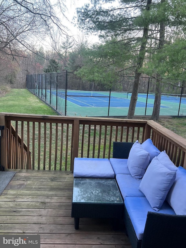 1646 Mcnelis Dr, Southampton, PA 18966 - wooden terrace featuring an outdoor hangout area, a tennis court, fence, and a lawn