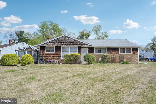 ranch-style house featuring a front lawn and a chimney