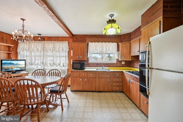 kitchen featuring a sink, an inviting chandelier, beamed ceiling, brown cabinets, and black appliances