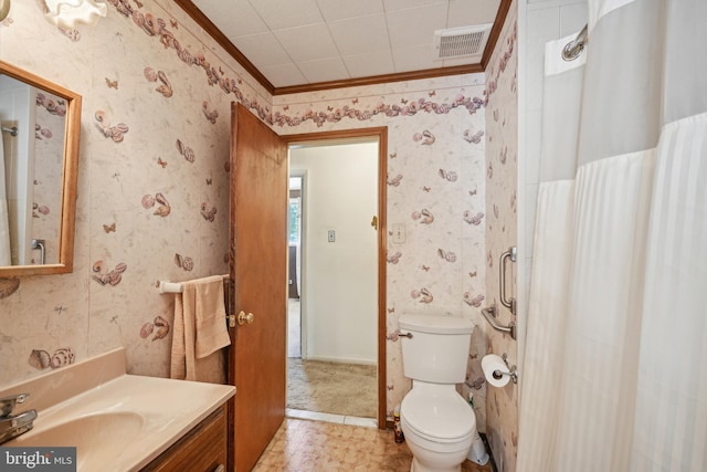 bathroom with wallpapered walls, visible vents, toilet, vanity, and ornamental molding