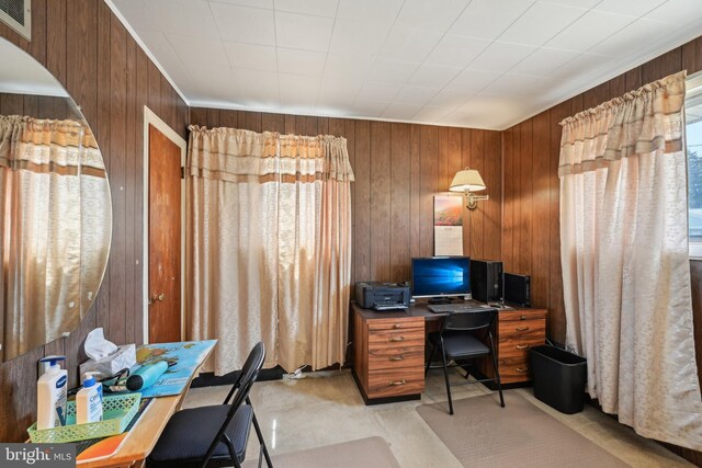 office area featuring wood walls