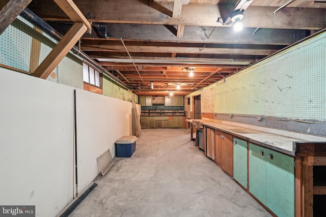 unfinished below grade area with a workshop area