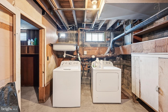 laundry room with separate washer and dryer and laundry area