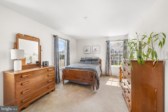 bedroom featuring light colored carpet