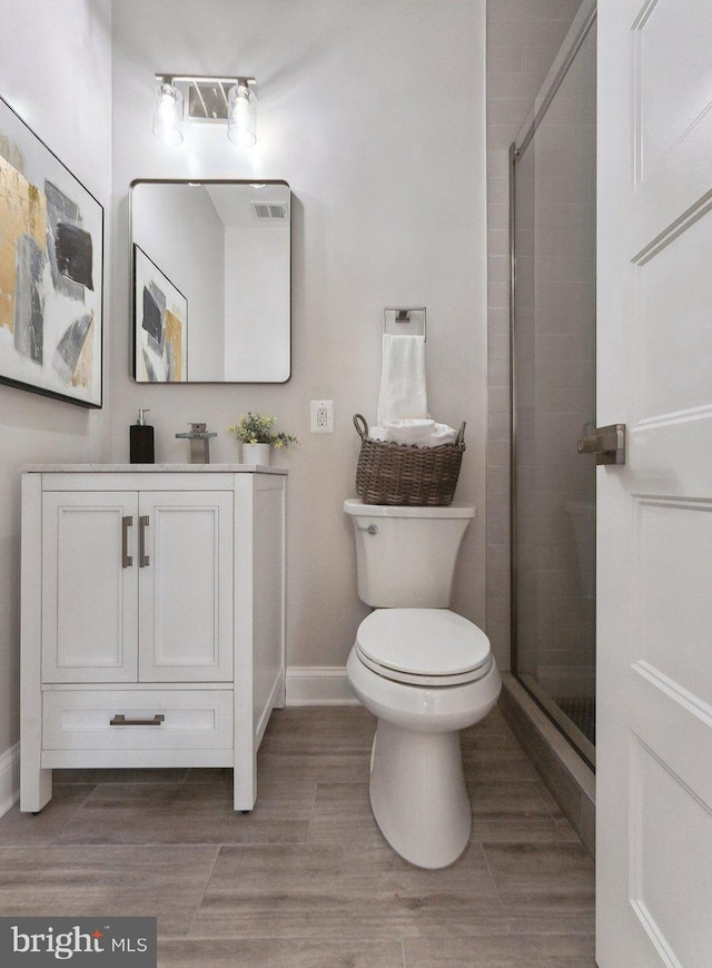 5707 Colorado Ave NW, Washington, DC 20011 - full bath featuring visible vents, toilet, baseboards, and a stall shower