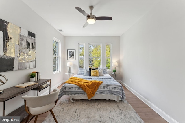5707 Colorado Ave NW, Washington, DC 20011 - bedroom with wood finished floors, visible vents, baseboards, and ceiling fan