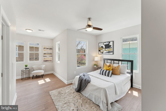 5707 Colorado Ave NW, Washington, DC 20011 - bedroom with wood finished floors, visible vents, a ceiling fan, and baseboards