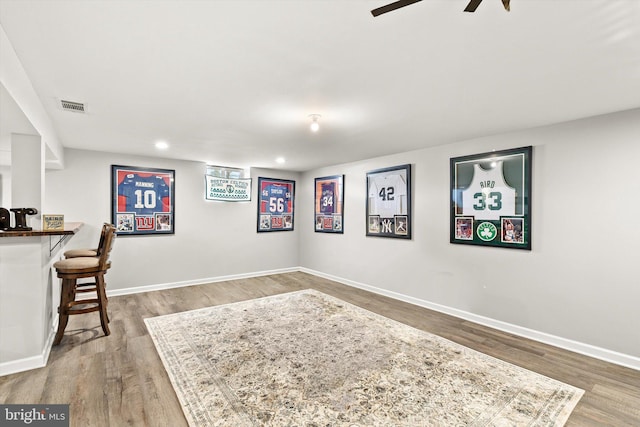 interior space featuring recessed lighting, wood finished floors, visible vents, and baseboards