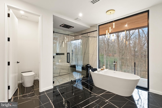 full bathroom with a freestanding tub, baseboards, toilet, a marble finish shower, and visible vents