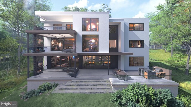 back of property with a patio area, stucco siding, a multi sided fireplace, and a balcony