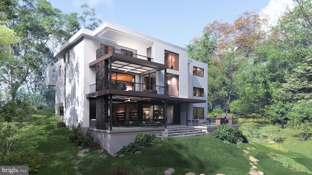 rear view of property with a lawn, stucco siding, a patio area, and a balcony