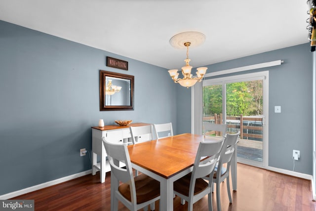 6011 Bauman Dr, Elkridge, MD 21075 - dining space featuring baseboards, wood finished floors, and a chandelier
