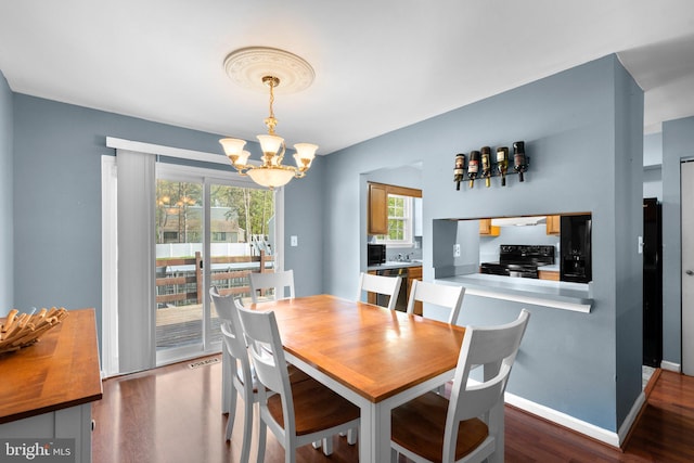 6011 Bauman Dr, Elkridge, MD 21075 - dining room with visible vents, wood finished floors, and a notable chandelier