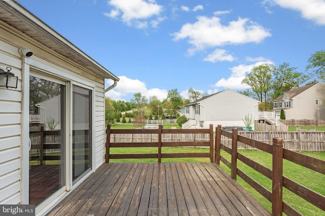 6011 Bauman Dr, Elkridge, MD 21075 - wooden deck with a fenced backyard, a residential view, and a lawn