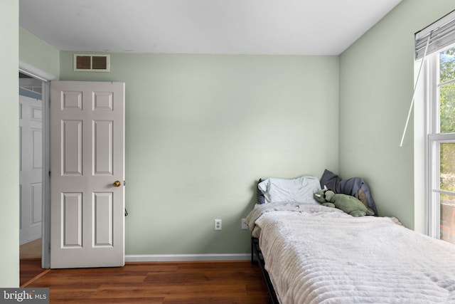 6011 Bauman Dr, Elkridge, MD 21075 - bedroom featuring baseboards, wood finished floors, and visible vents