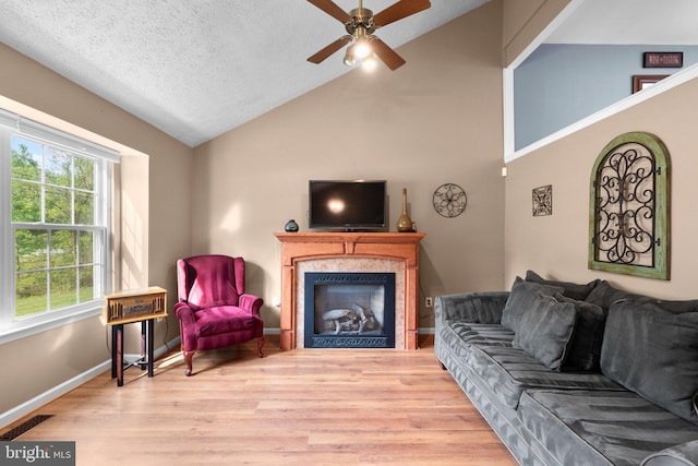 6011 Bauman Dr, Elkridge, MD 21075 - living area with visible vents, lofted ceiling, a ceiling fan, wood finished floors, and a fireplace