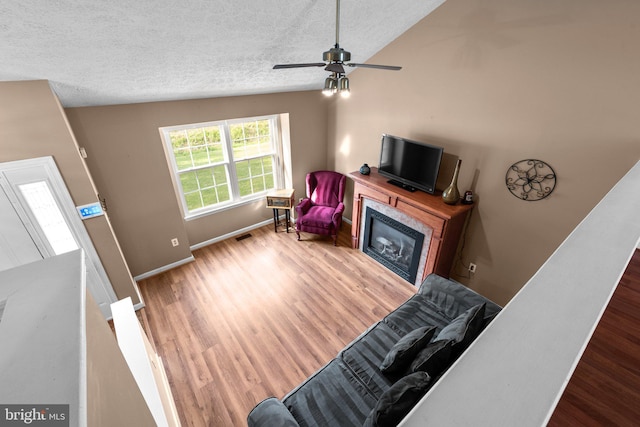 6011 Bauman Dr, Elkridge, MD 21075 - living room featuring wood finished floors, a textured ceiling, and baseboards