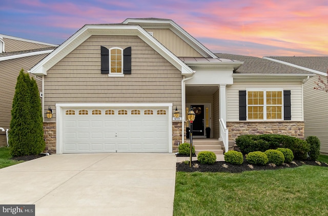 view of front of home with concrete driveway, stone siding, and a garage