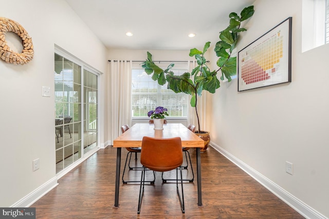 dining space with dark wood-type flooring, baseboards, and recessed lighting