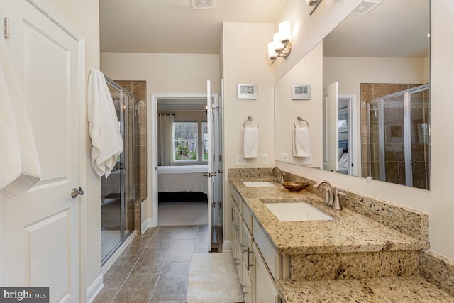 full bath featuring a shower stall, ensuite bathroom, a sink, and visible vents