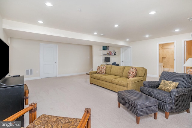 living room with light carpet, recessed lighting, visible vents, and baseboards
