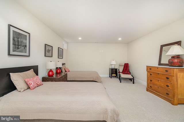carpeted bedroom with recessed lighting and baseboards